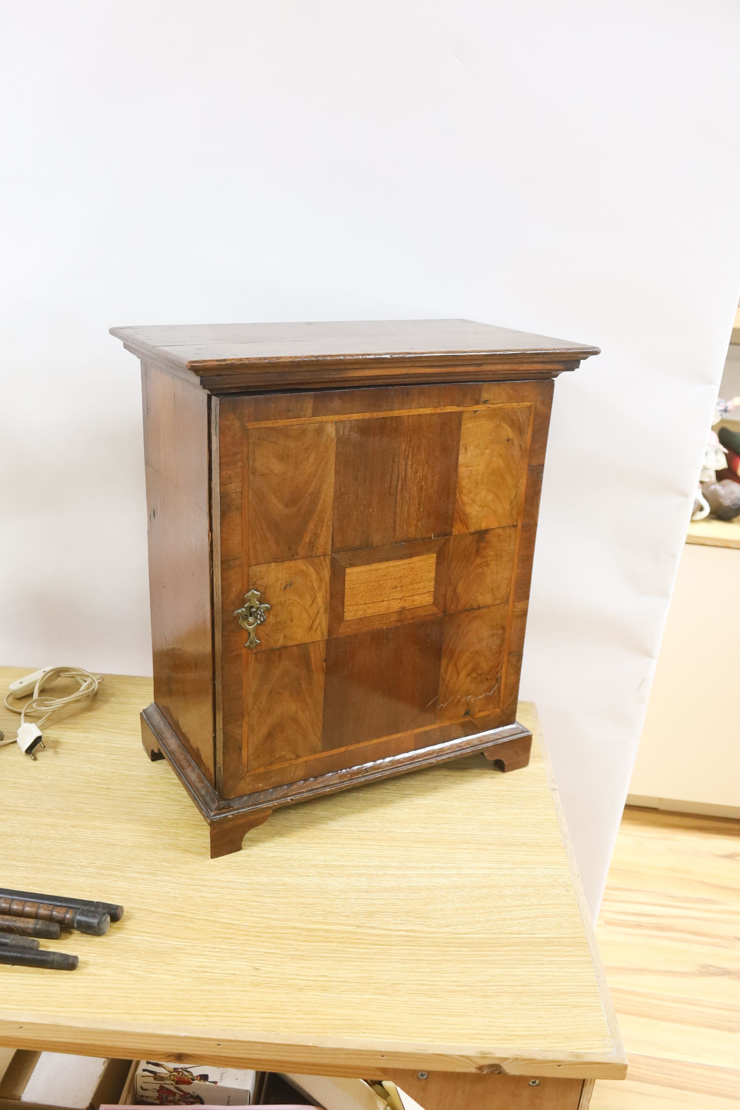 An 18th century and later walnut and oak cabinet of drawers 52cm